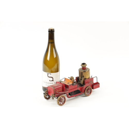 80a - A LATE 20TH CENTURY PRESSED STEEL MUSICAL FIRE 'PUMPER' ENGINE TOY MODEL painted with a red ground a... 