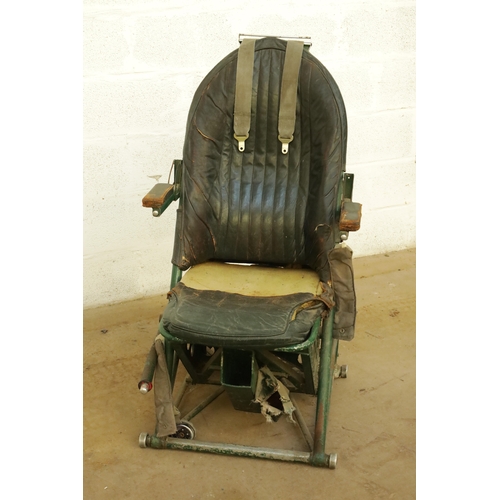 85 - AN EARLY AIRCRAFT LEATHER UPHOLSTERED PILOTS SEAT with adjustable armrests and green steel frame. (1... 