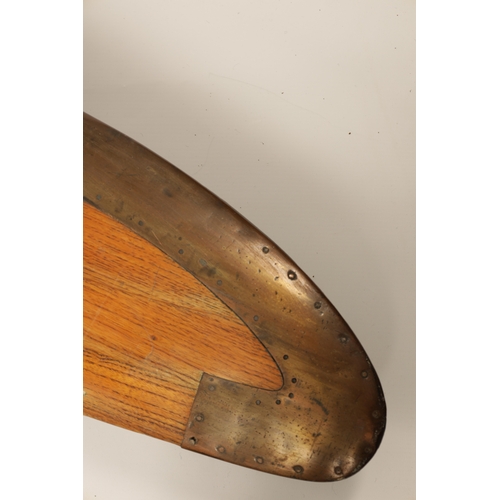 86 - AN EARLY 20TH CENTURY WW1 PROPELLER BLADE with brass tips and shaped blades (281cm overall)