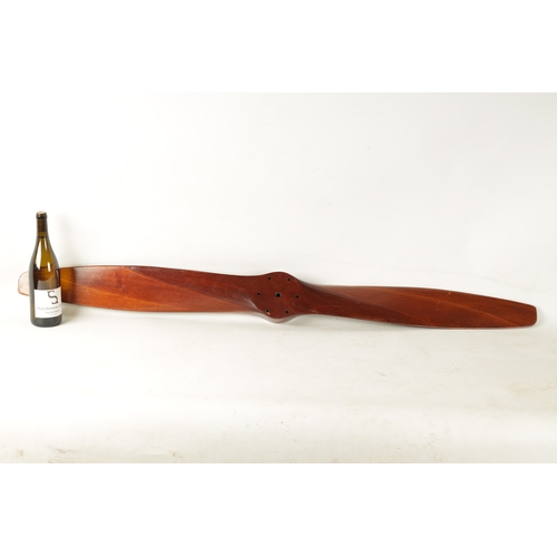 87a - AN 20TH CENTURY LAMINATED MAHOGANY PROPELLOR (138cm overall)