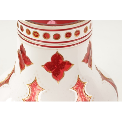 1 - A LATE 19TH CENTURY BOHEMIAN OVERLAY CUT CRANBERRY GLASS VASE with gilt decoration (25cm high )