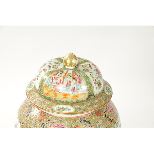 102 - A LARGE 19TH CENTURY CANTONESE FAMILLE ROSE VASE AND COVER of baluster form with decorated panels de... 