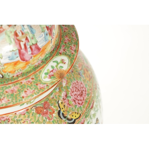 102 - A LARGE 19TH CENTURY CANTONESE FAMILLE ROSE VASE AND COVER of baluster form with decorated panels de... 