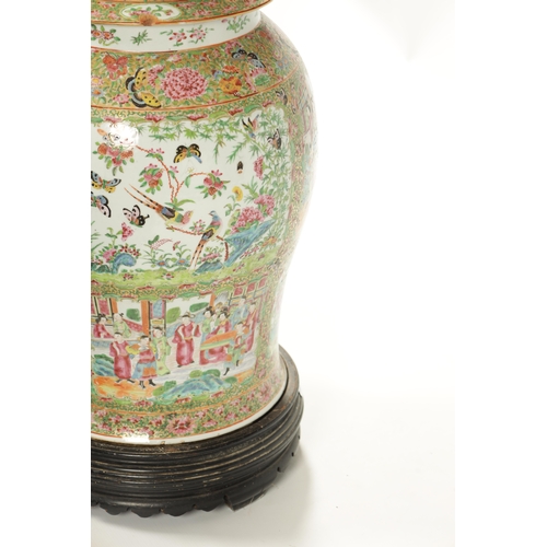 102 - A LARGE 19TH CENTURY CANTONESE FAMILLE ROSE VASE AND COVER of baluster form with decorated panels de... 