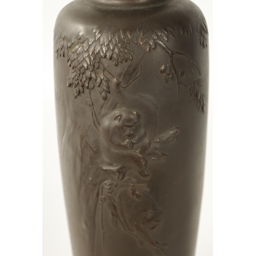 104 - A JAPANESE MEIJI PERIOD PATINATED BRONZE VASE finely decorated with monkeys sat in branch work - sig... 