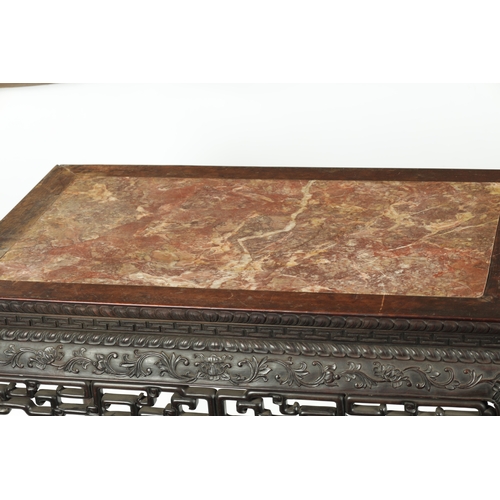 107 - A FINE 19TH CENTURY CHINESE CARVED HARDWOOD CENTRE TABLE the plain rectangular top enclosing a stria... 