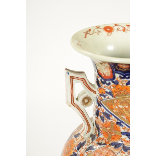 109 - A LARGE 19TH CENTURY IMARI BULBOUS VASE with polychrome coloured body and shaped side handles (54.5c... 