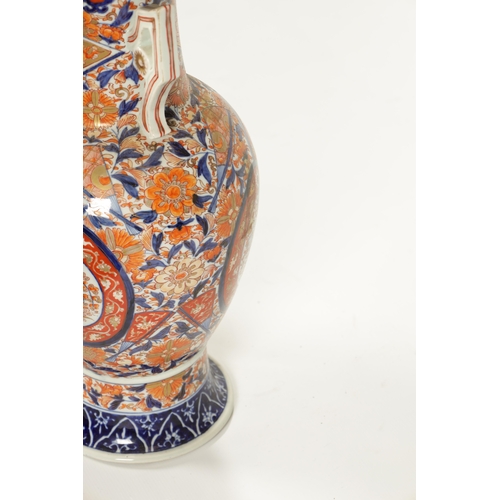 109 - A LARGE 19TH CENTURY IMARI BULBOUS VASE with polychrome coloured body and shaped side handles (54.5c... 