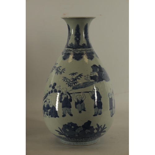 111 - A CHINESE BLUE AND WHITE PORCELAIN VASE of pear shape form decorated with boys playing in a garden l... 