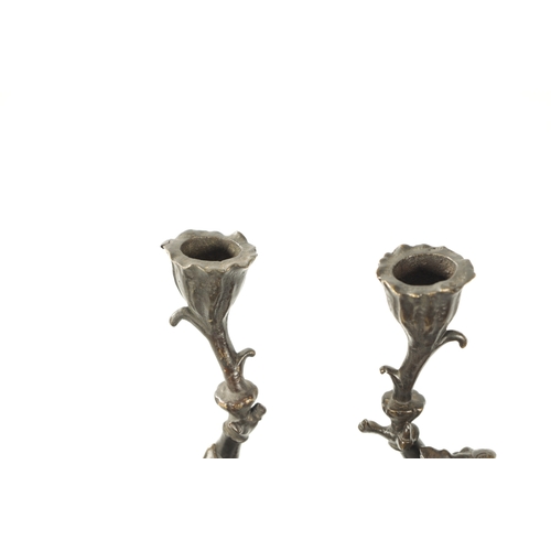 114 - A PAIR OF JAPANESE MEIJI PERIOD PATINATED BRONZE FIGURAL CANDLESTICKS each modelled as a frog warrio... 