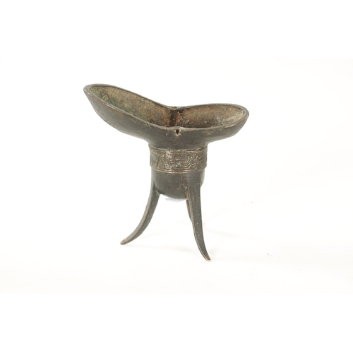 127 - AN EARLY CHINESE BRONZE ARCHAISTIC WINE VESSEL 'JUE' of boat shape with banded geometric designs, si... 