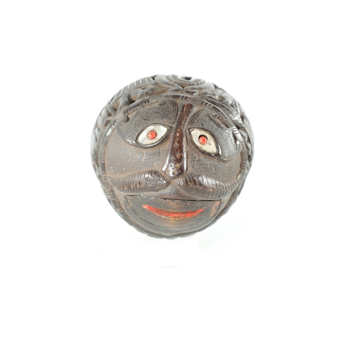 132 - AN EARLY 19TH CENTURY EASTERN CARVED COCONUT BUGBEAR MONEYBOX with a grotesque face and inlaid eyes ... 