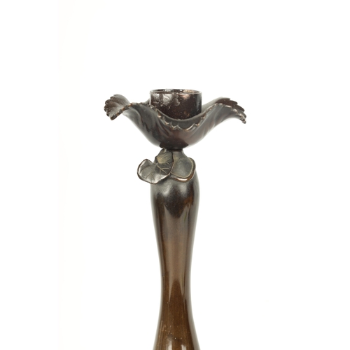 139 - A FINE PAIR OF JAPANESE MEIJI PATINATED BRONZE FIGURAL CANDLESTICKS the plain slender ovoid vase sha... 