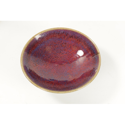 149 - A CHINESE SAND DE BOEUF FLAMBE GLAZED FLARED RIM BOWL (18.5cm diameter)