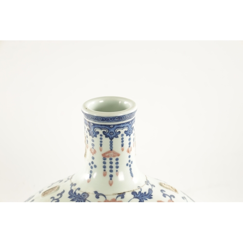 150 - A LARGE CHINESE AUBERGINE, BLUE AND WHITE PORCELAIN MOON FLASK with scrollwork and flowerhead design... 