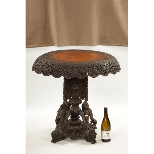 153 - A IMPRESSIVE 19TH CENTURY ANGLO INDIAN HARDWOOD CENTRE TABLE with carved leaf work animal and temple... 