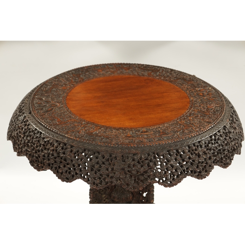 153 - A IMPRESSIVE 19TH CENTURY ANGLO INDIAN HARDWOOD CENTRE TABLE with carved leaf work animal and temple... 