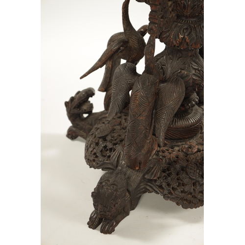 153 - A IMPRESSIVE 19TH CENTURY ANGLO INDIAN HARDWOOD CENTRE TABLE with carved leaf work animal and temple... 