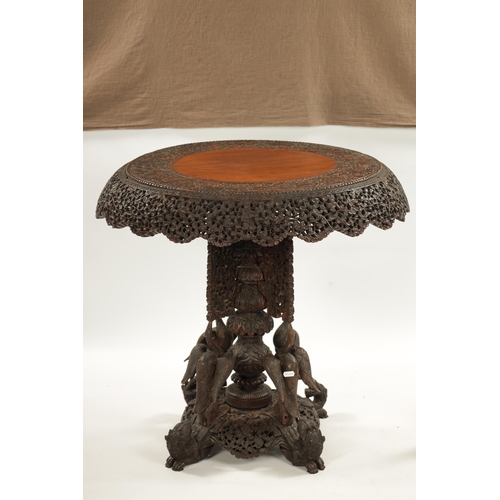 153 - A IMPRESSIVE 19TH CENTURY ANGLO INDIAN HARDWOOD CENTRE TABLE with carved leaf work animal and temple... 