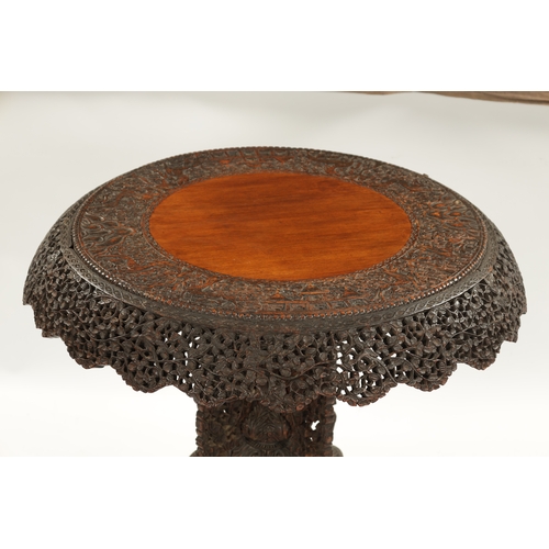 153 - A IMPRESSIVE 19TH CENTURY ANGLO INDIAN HARDWOOD CENTRE TABLE with carved leaf work animal and temple... 