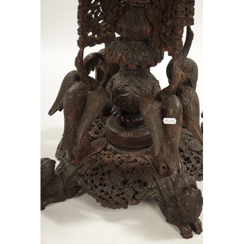 153 - A IMPRESSIVE 19TH CENTURY ANGLO INDIAN HARDWOOD CENTRE TABLE with carved leaf work animal and temple... 