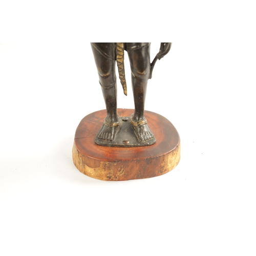 156 - AN EARLY BRONZE AND GILT BRONZE INDIAN FIGURE OF TARA mounted on a wooden base (36cm high )