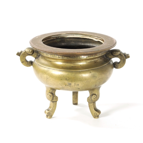 164 - AN 18TH/19TH CENTURY CHINESE CAST BRONZE CENSOR of bulbous form, elephant trunk handles; raised on t... 