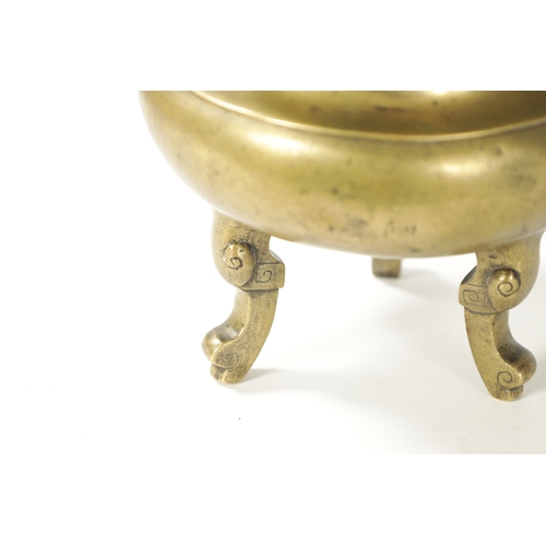 164 - AN 18TH/19TH CENTURY CHINESE CAST BRONZE CENSOR of bulbous form, elephant trunk handles; raised on t... 