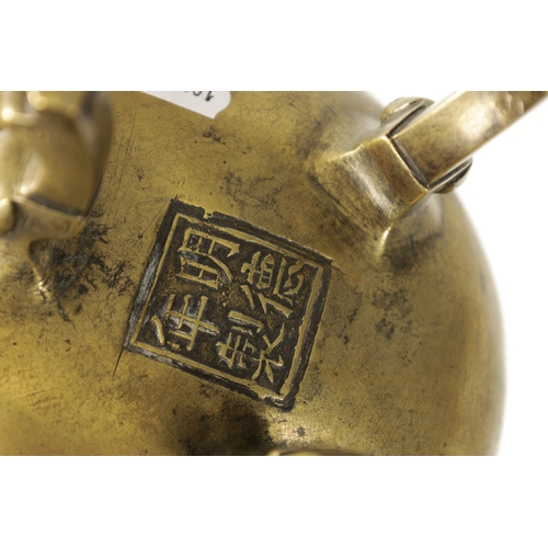 164 - AN 18TH/19TH CENTURY CHINESE CAST BRONZE CENSOR of bulbous form, elephant trunk handles; raised on t... 