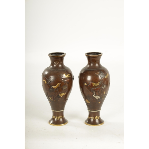 165 - A PAIR OF JAPANESE MEIJI PERIOD MIXED METAL BRONZE VASES finely decorated with birds amongst flowers... 