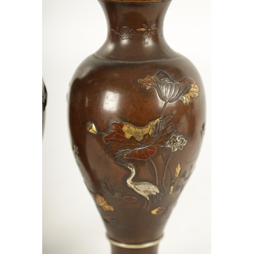 165 - A PAIR OF JAPANESE MEIJI PERIOD MIXED METAL BRONZE VASES finely decorated with birds amongst flowers... 