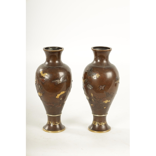 165 - A PAIR OF JAPANESE MEIJI PERIOD MIXED METAL BRONZE VASES finely decorated with birds amongst flowers... 