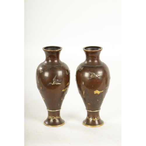 165 - A PAIR OF JAPANESE MEIJI PERIOD MIXED METAL BRONZE VASES finely decorated with birds amongst flowers... 