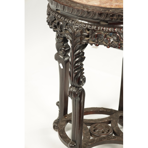 167 - AN OVERSIZED 19TH CENTURY CHINESE CARVED HARDWOOD CENTRE TABLE /VASE STAND the circular top with scr... 