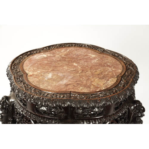 176 - AN OVERSIZED 19TH CENTURY CHINESE FINELY CARVED CENTRE TABLE /VASE STAND the slightly scalloped top ... 