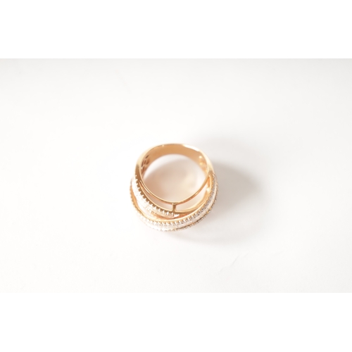 179 - AN 18CT ROSE GOLD AND DIAMOND SET TRIPLE BAND RING with baguette cut and brilliant cut diamonds on e... 