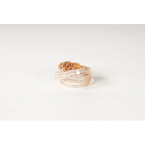 179 - AN 18CT ROSE GOLD AND DIAMOND SET TRIPLE BAND RING with baguette cut and brilliant cut diamonds on e... 