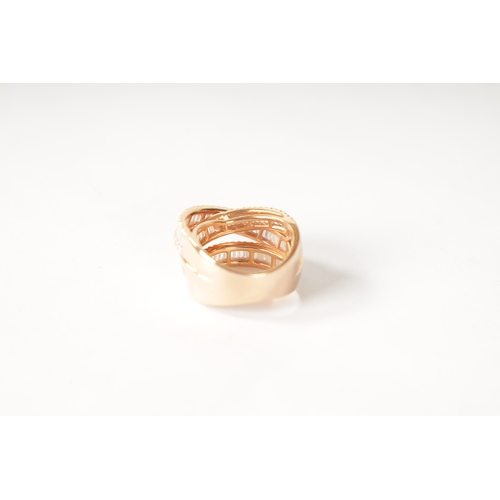 179 - AN 18CT ROSE GOLD AND DIAMOND SET TRIPLE BAND RING with baguette cut and brilliant cut diamonds on e... 