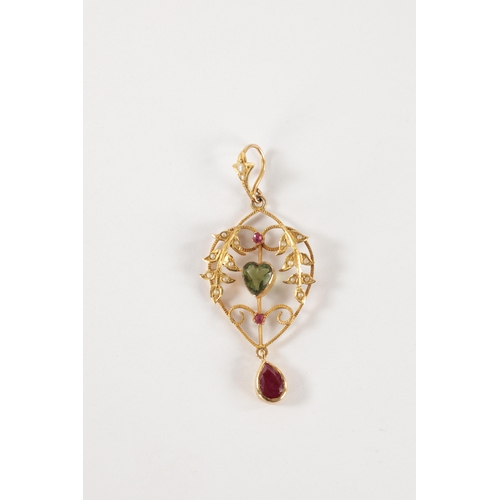 180 - A LATE 19TH CENTURY GOLD, RUBY AND PEARL SUFFRAGETTE PENDANT the open work floral frame with pearl s... 