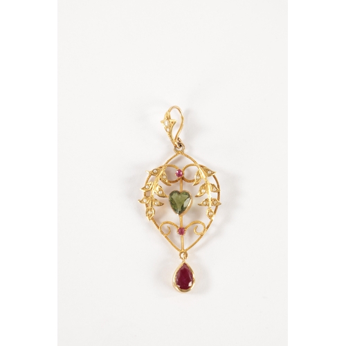 180 - A LATE 19TH CENTURY GOLD, RUBY AND PEARL SUFFRAGETTE PENDANT the open work floral frame with pearl s... 