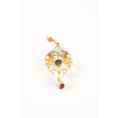 180 - A LATE 19TH CENTURY GOLD, RUBY AND PEARL SUFFRAGETTE PENDANT the open work floral frame with pearl s... 