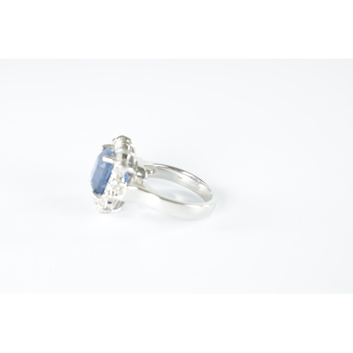 188 - A LADIES LARGE 18CT WHITE GOLD SAPPHIRE AND DIAMOND RING the cushion shaped sapphire app. 3.0ct surr... 