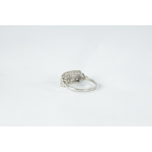 189 - A LADIES ART DECO PLATINUM AND DIAMOND RING with 19 brilliant diamonds in a rubover setting on a pie... 