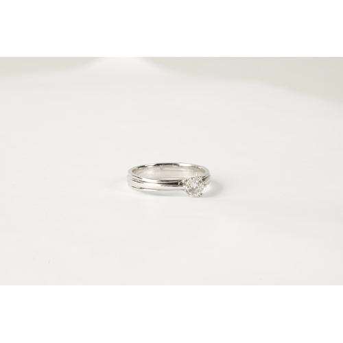 198 - A 0.31CT DIAMOND AND 18CT WHITE GOLD SOLITAIRE RING with a ribbon-shaped band, SI2 clarity (AnchorCe... 