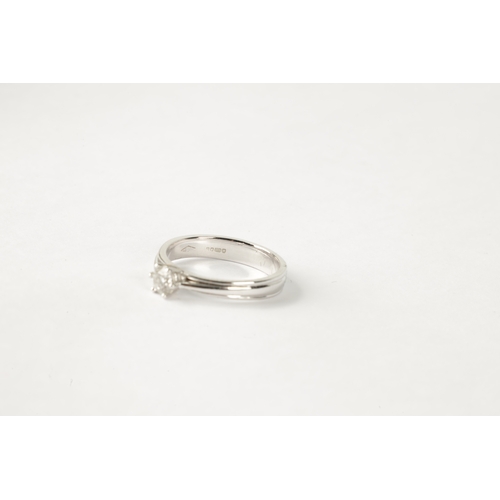 198 - A 0.31CT DIAMOND AND 18CT WHITE GOLD SOLITAIRE RING with a ribbon-shaped band, SI2 clarity (AnchorCe... 