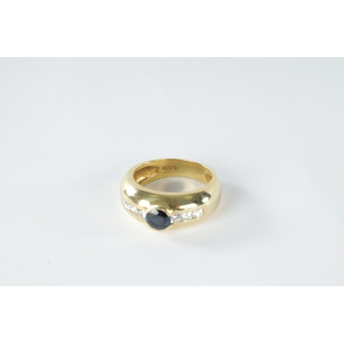 210 - A LADIES 18CT YELLOW GOLD DIAMOND AND SAPPHIRE DOME RING with central brilliant cut sapphire flanked... 