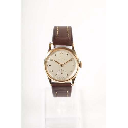 221 - A GENTLEMAN’S 9CT GOLD RECORD MANUAL WINDING WRISTWATCH with chamfered bezel surrounding a silvered ... 