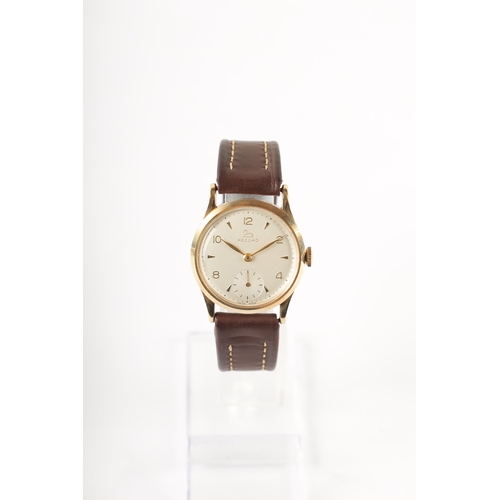 221 - A GENTLEMAN’S 9CT GOLD RECORD MANUAL WINDING WRISTWATCH with chamfered bezel surrounding a silvered ... 