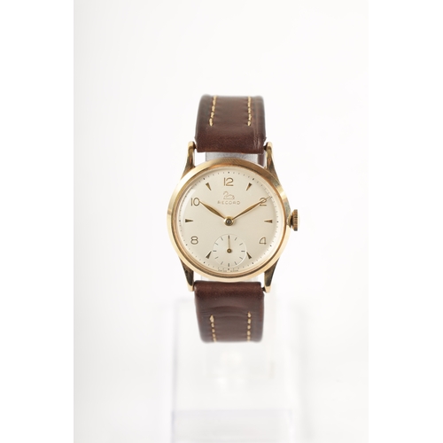 221 - A GENTLEMAN’S 9CT GOLD RECORD MANUAL WINDING WRISTWATCH with chamfered bezel surrounding a silvered ... 