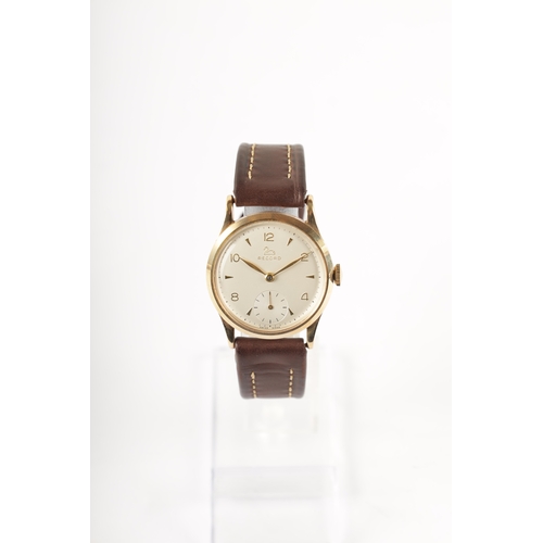 221 - A GENTLEMAN’S 9CT GOLD RECORD MANUAL WINDING WRISTWATCH with chamfered bezel surrounding a silvered ... 